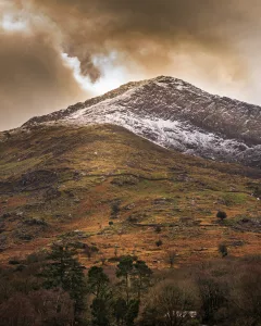 Clouds Set Over A Dark Snow Mountain