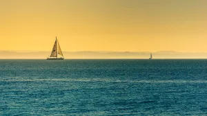 A Boat Sails In The Sunset