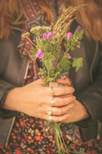 Bohemian Ring Set On A Hand Holding Wildflowers