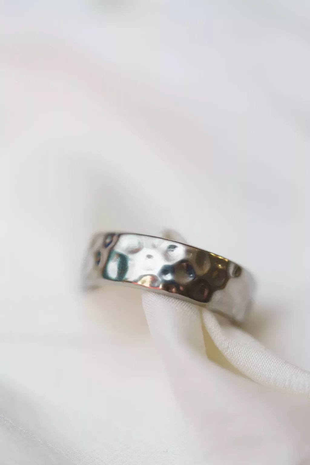 Wedding Ring With White Soft Fabric Background
