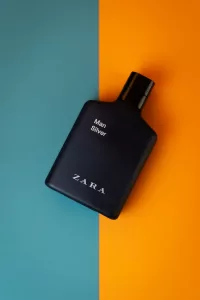 Perfume Bottle Flatlay On Orange and Teal Background